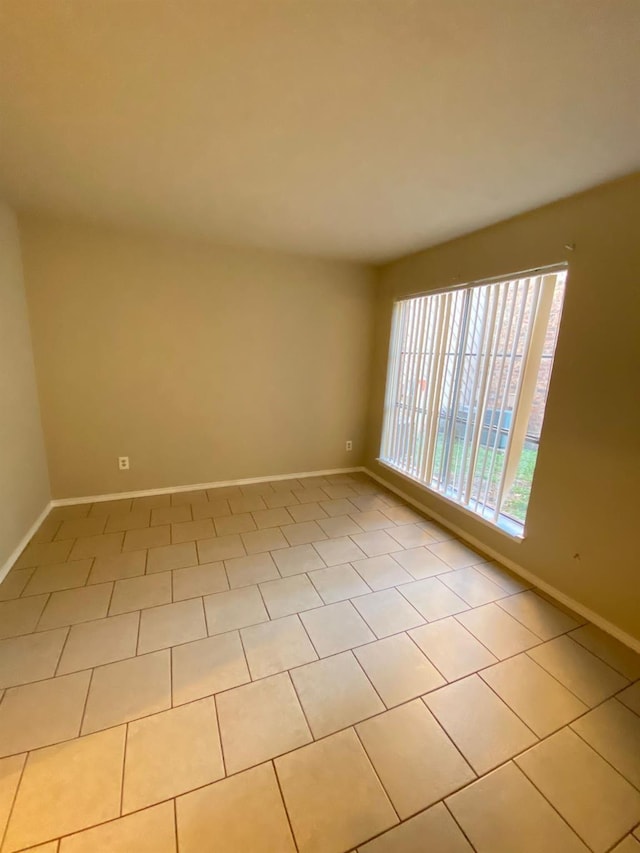 empty room featuring light tile patterned floors