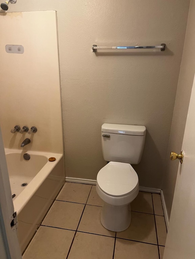 bathroom featuring tile patterned floors and toilet