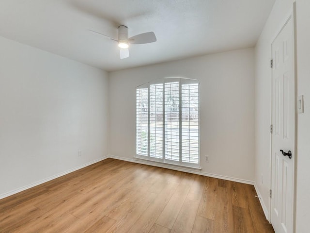 empty room featuring light wood-type flooring and ceiling fan