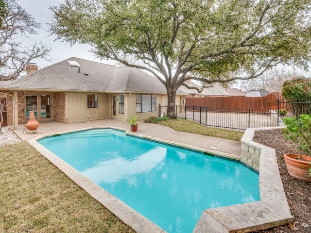 view of swimming pool with a patio area