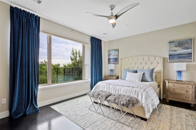 bedroom with ceiling fan and multiple windows