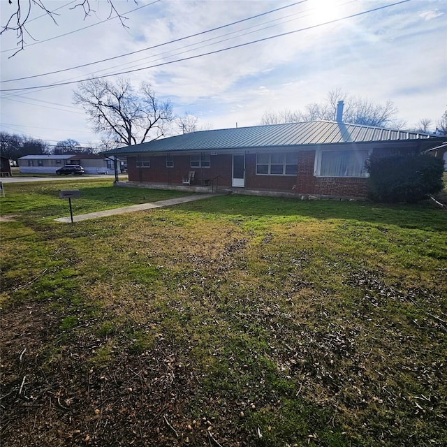 exterior space featuring a front lawn
