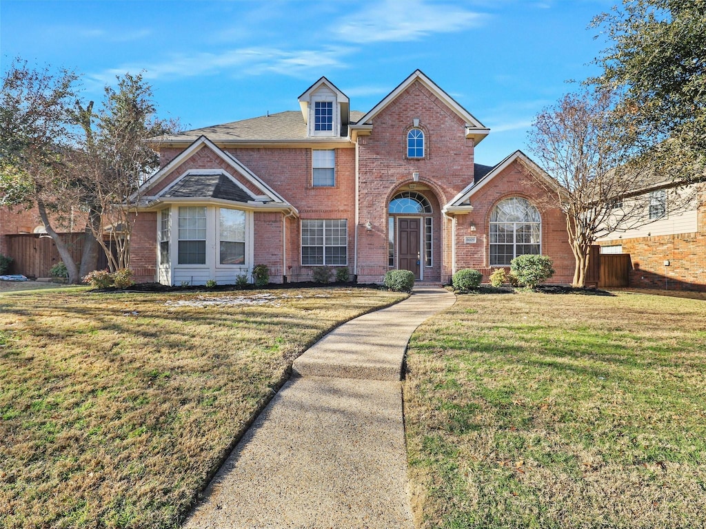 view of property featuring a front yard