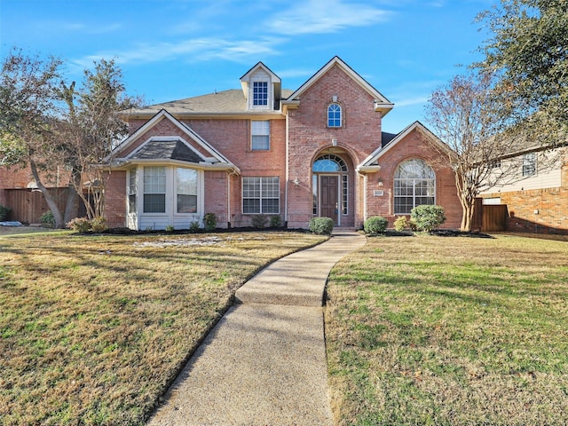 view of property featuring a front yard