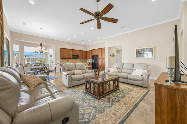 tiled living room featuring ceiling fan with notable chandelier and crown molding