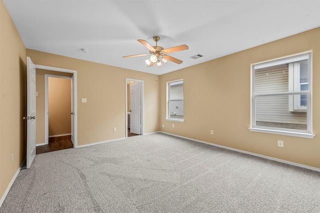 unfurnished bedroom featuring ceiling fan, light colored carpet, and a closet