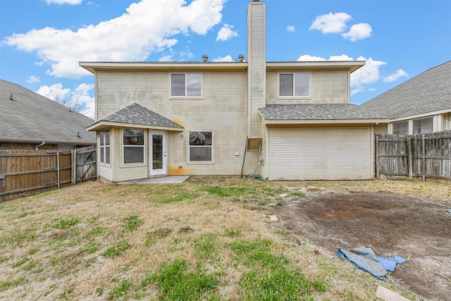 rear view of property with a lawn