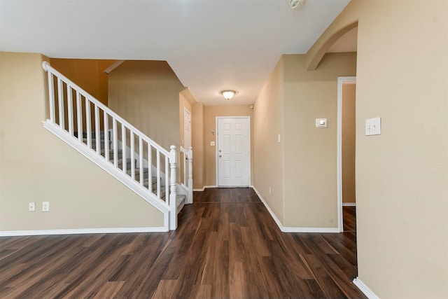 foyer with dark hardwood / wood-style floors