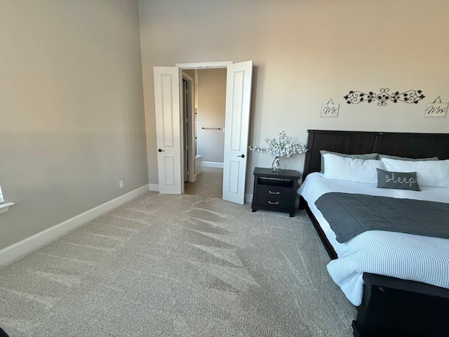 bedroom featuring light carpet