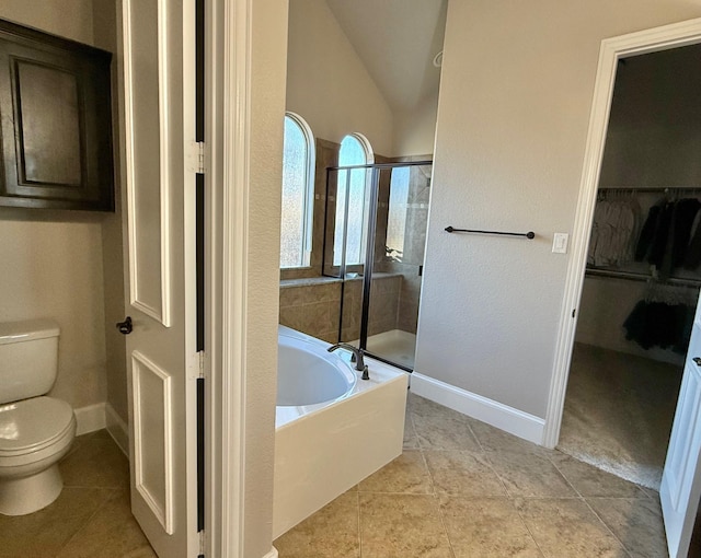 bathroom with tile patterned flooring, toilet, independent shower and bath, and vaulted ceiling