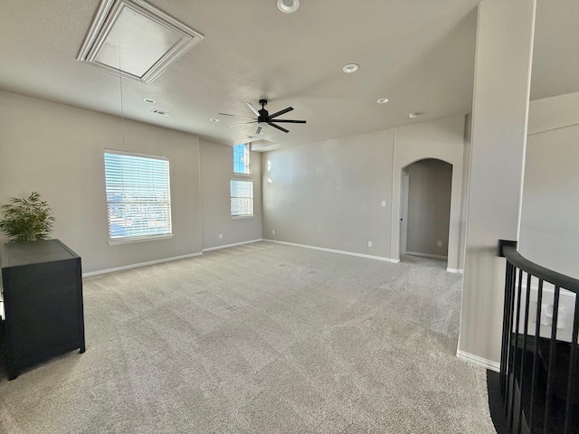 unfurnished room featuring ceiling fan and light colored carpet