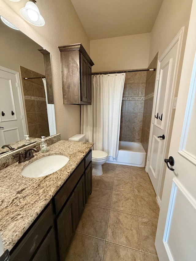 full bathroom featuring toilet, tile patterned flooring, shower / bathtub combination with curtain, and vanity