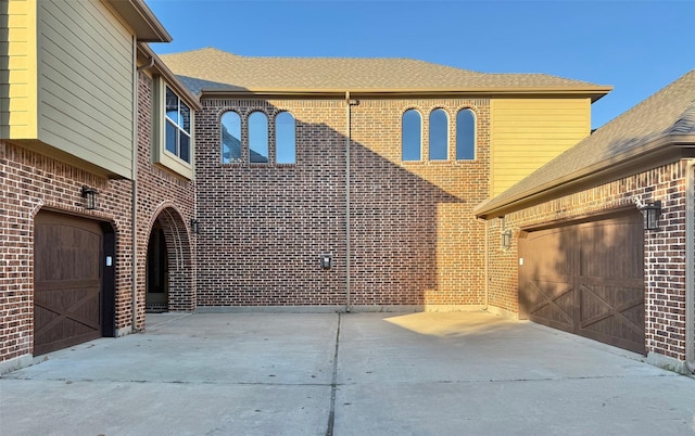 view of patio / terrace featuring a garage