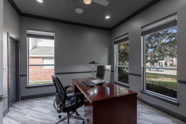 home office with crown molding and light hardwood / wood-style floors