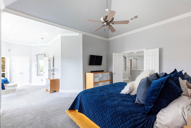 carpeted bedroom with a high ceiling, ornamental molding, ceiling fan, and ensuite bathroom