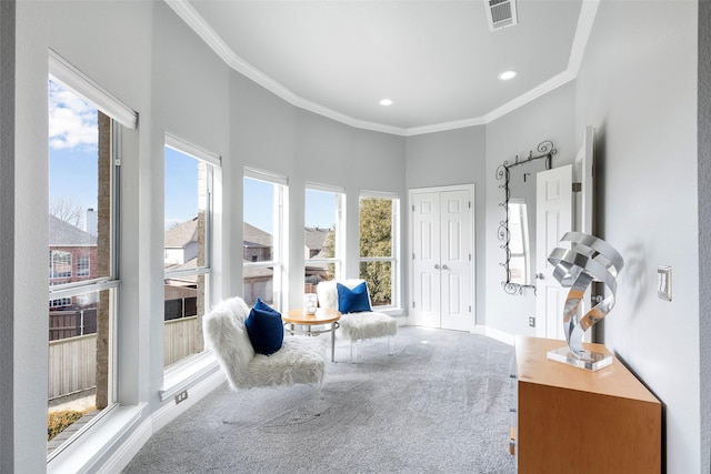 sitting room featuring visible vents, baseboards, ornamental molding, carpet floors, and recessed lighting