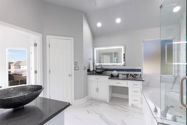 bathroom with vanity, plus walk in shower, and vaulted ceiling