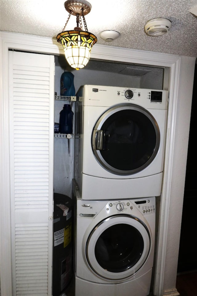 laundry area with stacked washer / drying machine