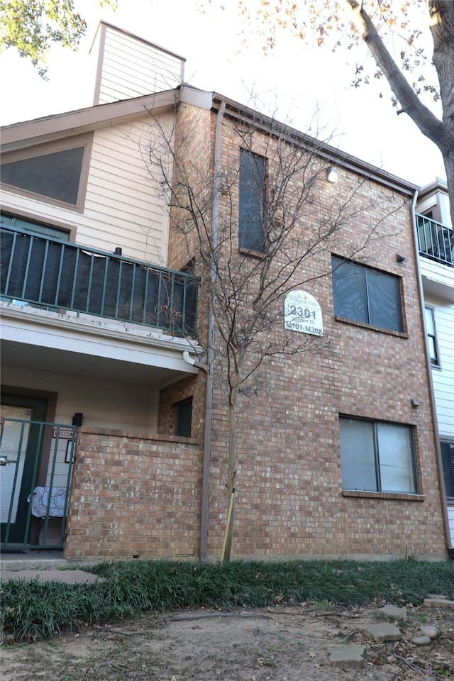 view of property exterior with a balcony