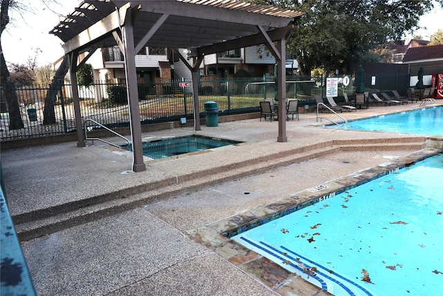 view of pool featuring a pergola and a community hot tub