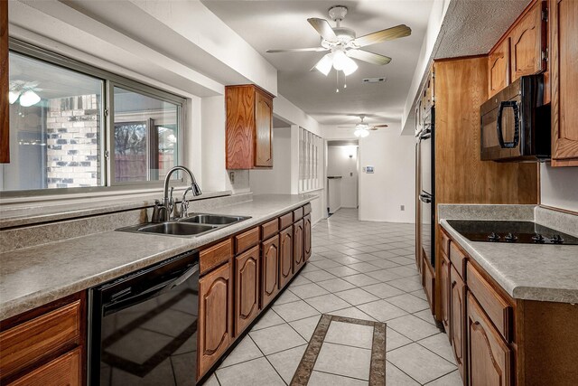 clothes washing area with light tile patterned flooring and independent washer and dryer