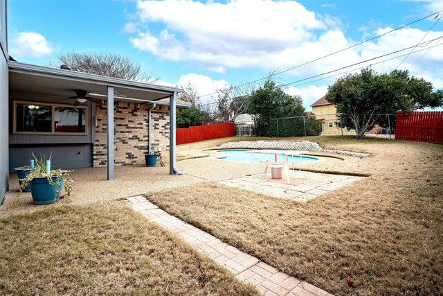 view of swimming pool featuring cooling unit, a yard, and a patio