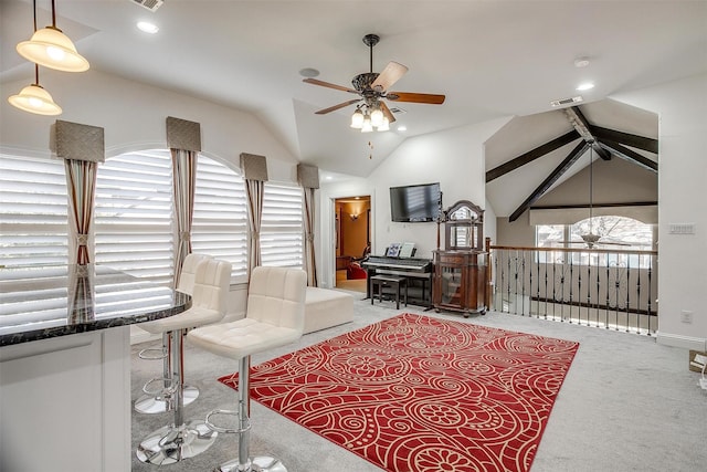 carpeted living room with vaulted ceiling and ceiling fan