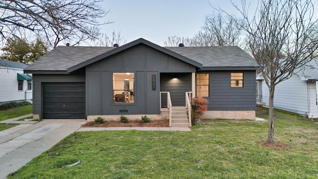 view of front facade with a front yard and a garage