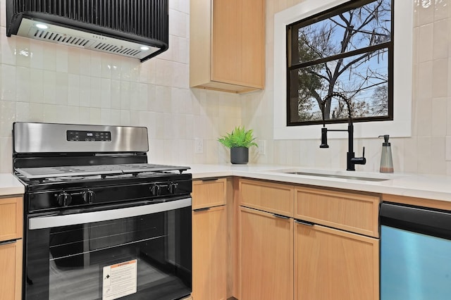 kitchen featuring light brown cabinetry, tasteful backsplash, black gas range oven, dishwashing machine, and exhaust hood