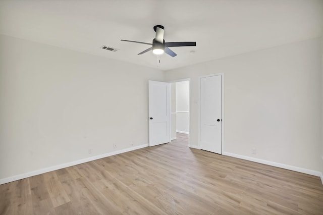 unfurnished room featuring light hardwood / wood-style floors and ceiling fan