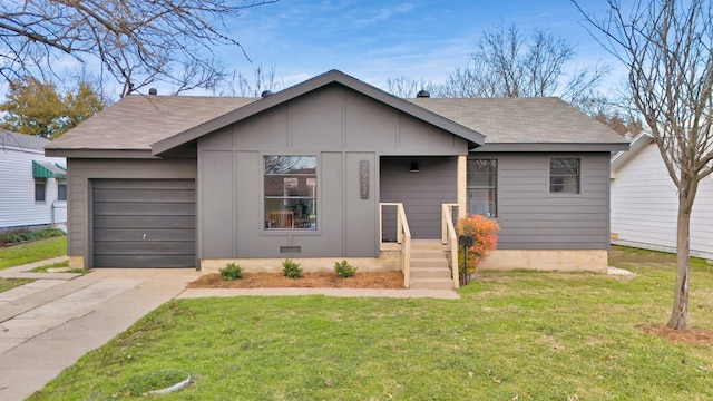 bungalow-style home with a front lawn and a garage