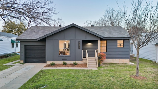 view of front facade with a garage and a front lawn