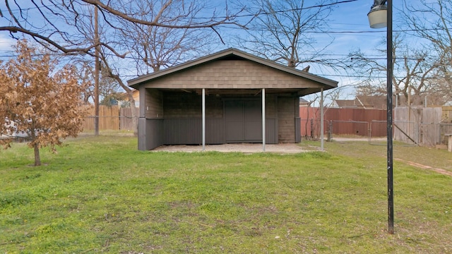 view of outdoor structure with a lawn