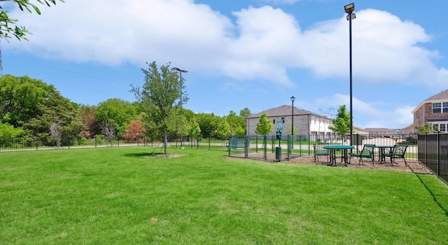 view of home's community with a lawn