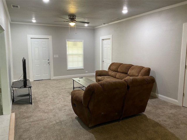 carpeted living room featuring ceiling fan and crown molding