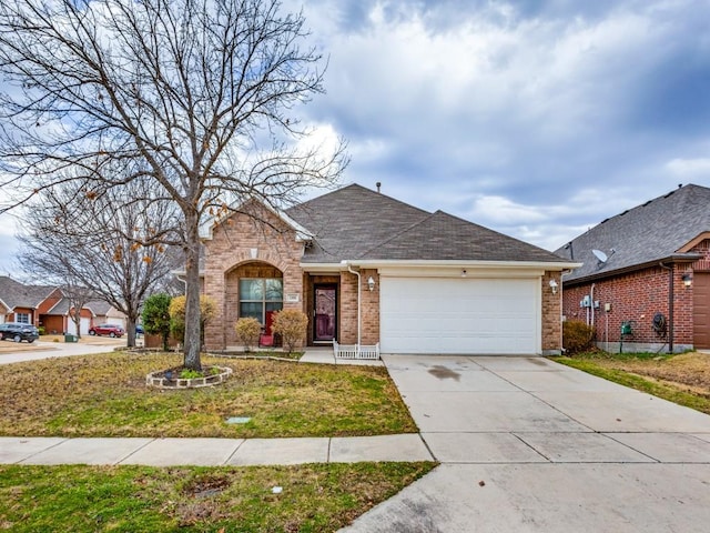 single story home with a garage and a front lawn