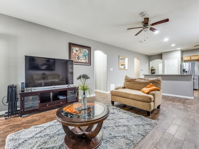 living room featuring ceiling fan