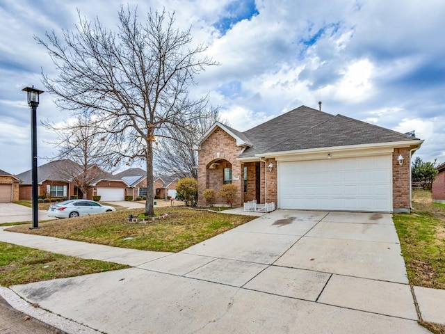 view of front facade with a front lawn and a garage