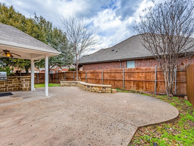 view of patio featuring ceiling fan and a grill