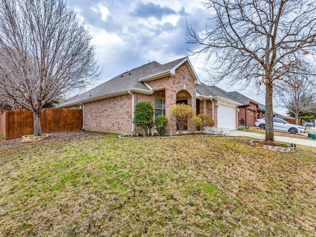 view of front of house featuring a front yard and a garage