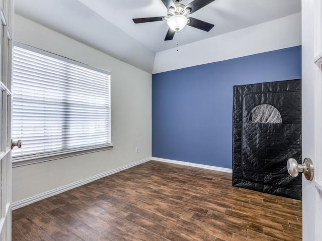 spare room with ceiling fan and dark hardwood / wood-style floors