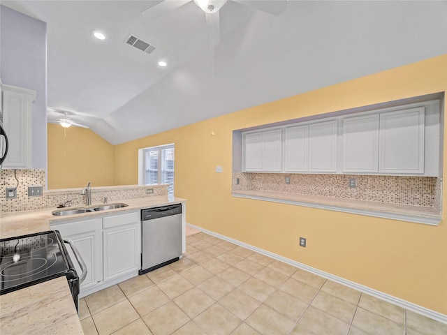 kitchen featuring vaulted ceiling, stainless steel dishwasher, white cabinets, and sink