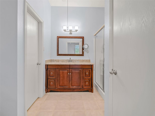 bathroom with vanity, tile patterned floors, and an enclosed shower