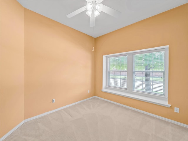 empty room with light carpet and a wealth of natural light