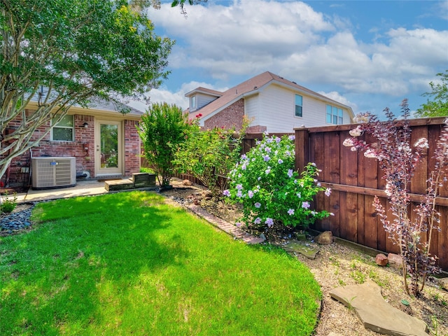 view of yard featuring central AC