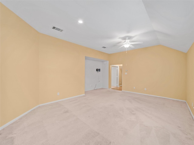 carpeted spare room with lofted ceiling and ceiling fan