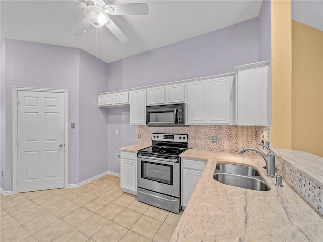 kitchen featuring sink, light tile patterned flooring, white cabinetry, light stone countertops, and stainless steel range with electric cooktop