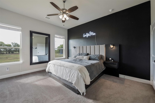 carpeted bedroom with ceiling fan