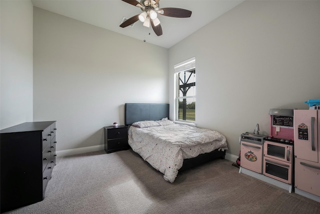 bedroom featuring ceiling fan, light colored carpet, and lofted ceiling