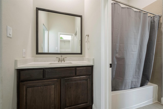 bathroom with tile patterned flooring, vanity, and shower / bath combo with shower curtain